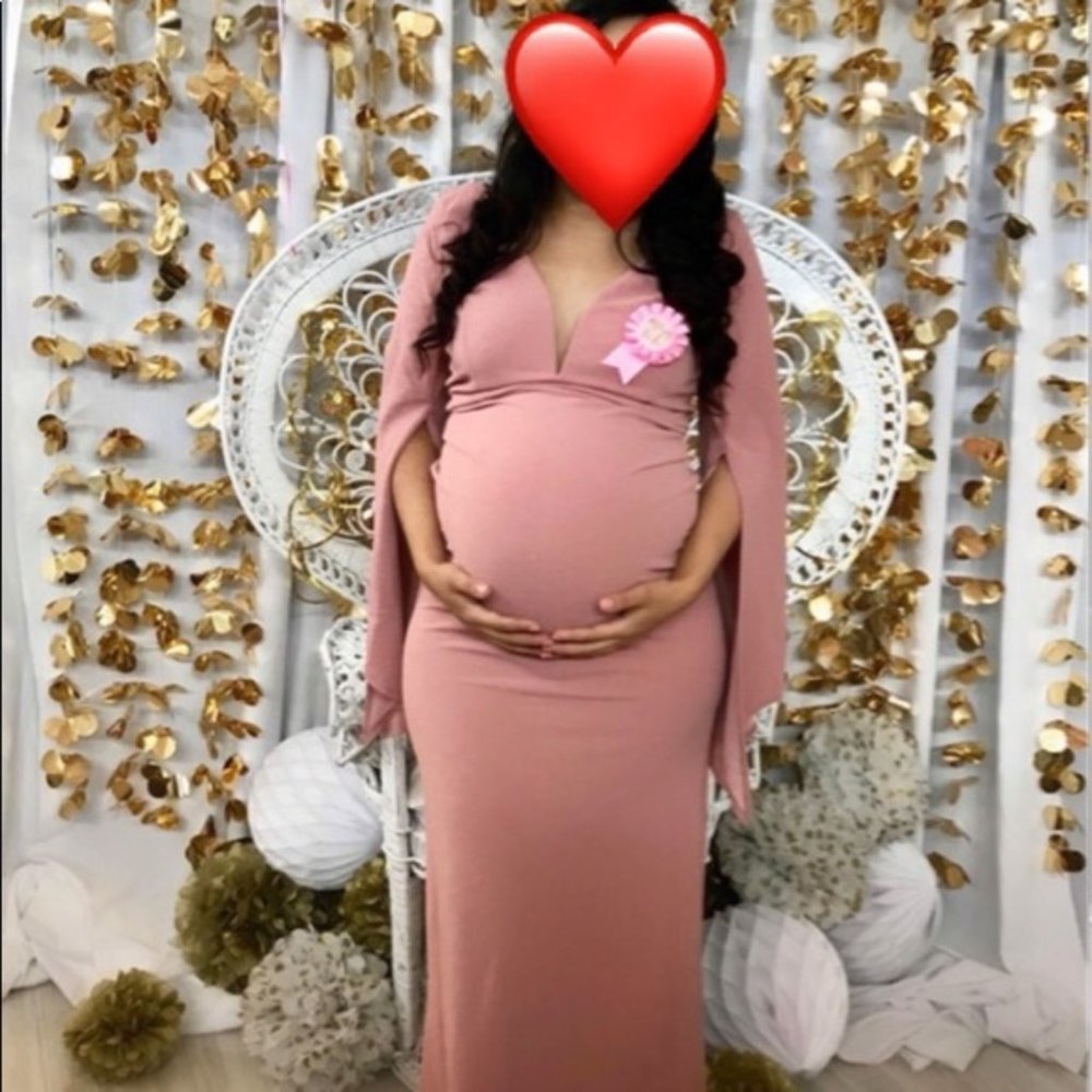 A tight dress For pregnant women I have one more in a size 2 really cute😘